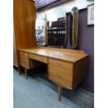 A mid-20th century walnut dressing table