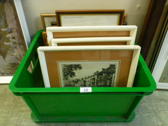 A box containing an assortment of prints