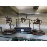 Three bronze sporting figures signed War