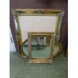 A gilt framed oval mirror along with a g