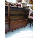 A mid-20th century mahogany bookcase wit