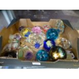 An assortment of glass paperweights