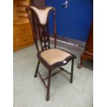 A Victorian walnut bedroom chair having
