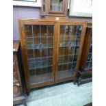 An early 20th century oak bookcase, the