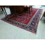 A hand woven Turkish rug, triple line bo