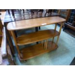 A light Ercol elm three tier stand