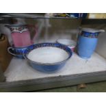 A decorative blue and white wash jug and