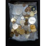 An assortment of coinage to include toke