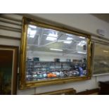 A gilt framed rectangular mirror