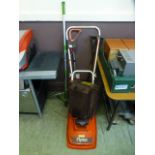 A Flymo electric lawn mower along with a