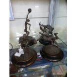 Four bronze sporting figures signed 'War