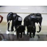 A herd of carved ebony elephants
