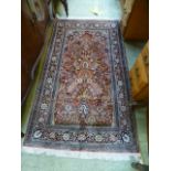 A hand woven silk Persian rug, the multi