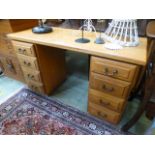 A modern oak twin pedestal desk