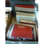 A tray containing old photographs, some