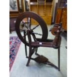 A stained beech spinning wheel