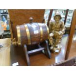 A miniature oak barrel on stand along wi