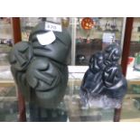 Two carved African stone figural groups