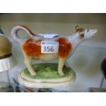 A 19th century ceramic cow creamer