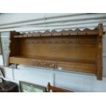 A quality oak wall hanging shelf with ra