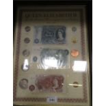 A framed pre-decimal coin and note displ