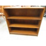 An oak effect low level bookcase