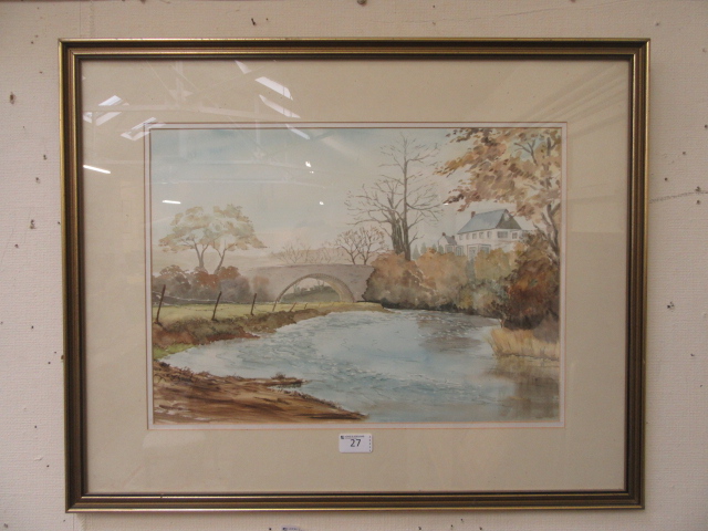 A framed and glazed watercolour of river