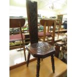 A carved oak Welsh spinning stool