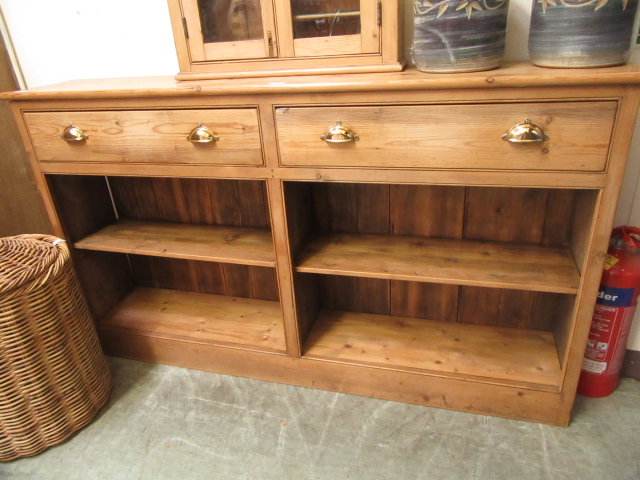 A waxed pine dresser base having two dra