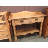 A waxed pine wash stand having raised ba