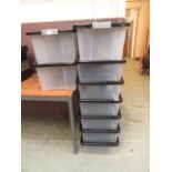 Nine PVC storage boxes with black lids