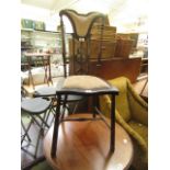 A Victorian walnut bedroom chair having