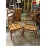 A pair of Ercol rail back dining chairs