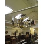 An eight branch brass chandelier