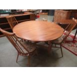 A light Ercol drop-leaf table together w
