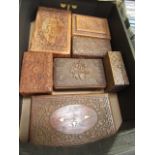 A tray of carved wooden boxes