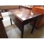 An 18th century oak drop leaf table