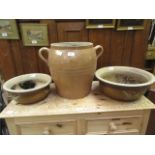 Two glazed garden pots together with a g