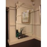 A large modern bevel glass wall mirror