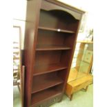 A modern rosewood effect bookcase with t