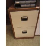 A two drawer metal filing cabinet with n
