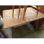 A light Ercol rectangular dining table