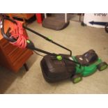 A small Glem 1030 electric lawn mower wi