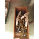 A box containing chrome taps, wall light