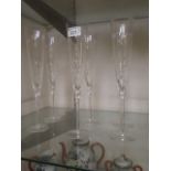 A set of six Dartington crystal champagn