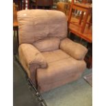 A large light brown upholstered reclinin