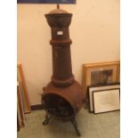 A cast metal chiminea