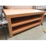 A modern beech effect cabinet having sto