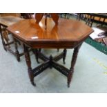 An Edwardian walnut octagon occasional t