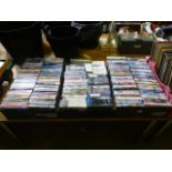 Three trays of DVDs and computer games
